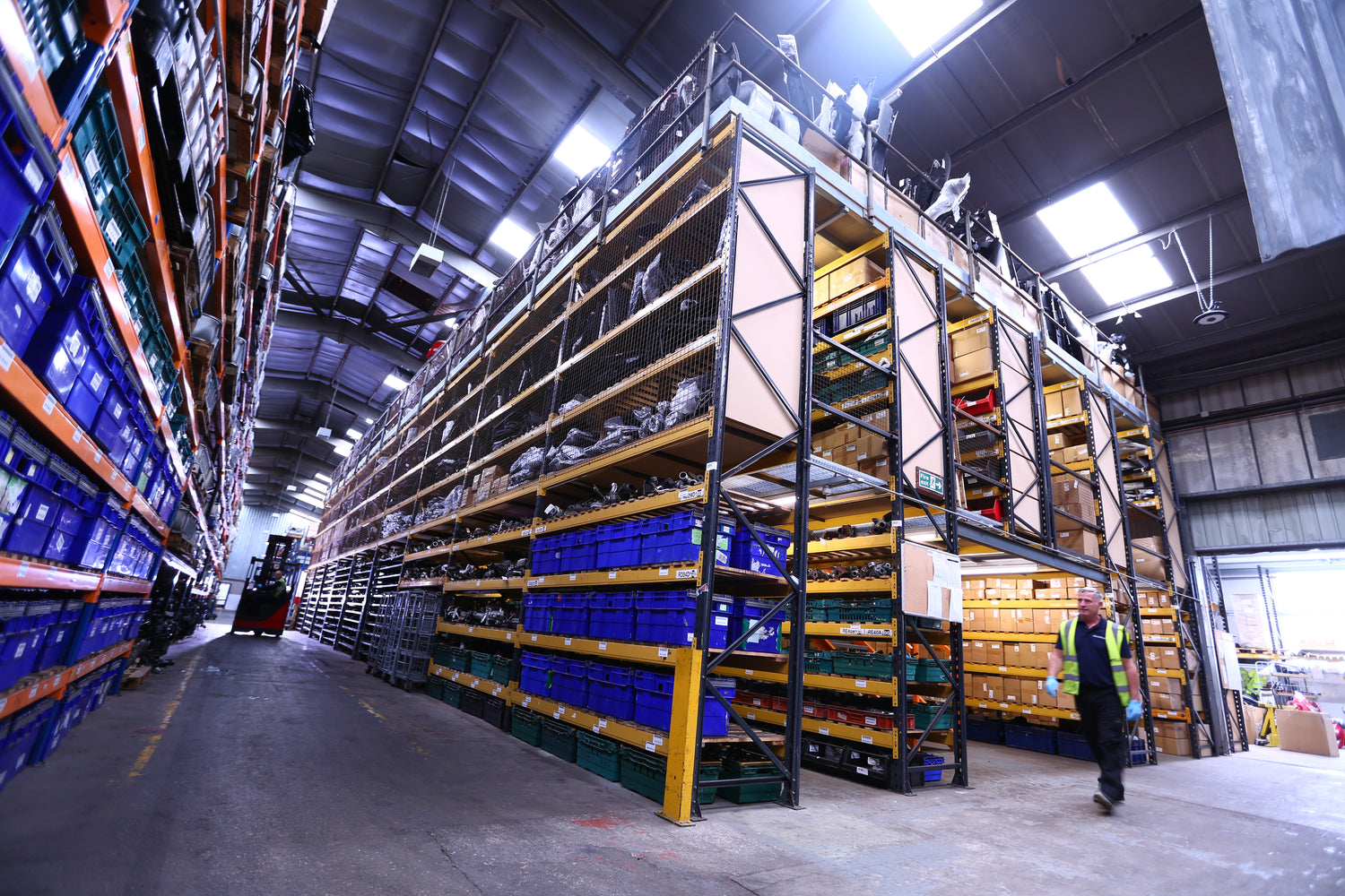 Warehouse interior with high shelves and storage racks.